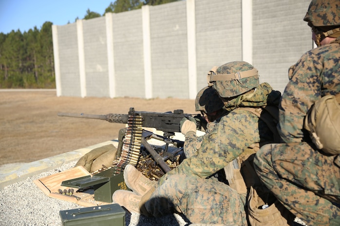 A Marine with 2nd Marine Logistics Group fires an M2 Browning .50-caliber machine gun during a live-fire exercise portion of the Battle Skills Training School machine gunner course aboard Camp Lejeune, N.C., Jan. 24, 2014. Marines going through the course attended daily classes about proper machine gun use and were tested on proper assembly and disassembly techniques, as well as firing the weapons at the end of the course. (U.S. Marine Corps photo by Lance Cpl. Shawn Valosin)