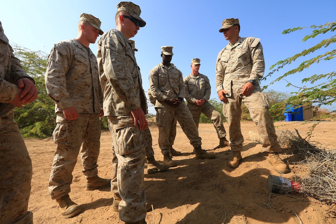 CAMP LEMONNIER, DJIBOUTI (Jan. 10, 2014)  – U.S. Marine Corps Staff Sgt. Jordan Torcello, an explosive ordnance team leader assigned to Explosive Ordnance Detachment, 13th Marine Expeditionary Unit, teaches Marines from Charlie Company, 13th MEU, the properties of a directional fragmentation charge during counter improvised explosive device (IED) training at Camp Lemonnier, Djibouti Jan. 10, 2014.  Approximately 50 Marines assigned to Charlie Company, 13th MEU completed counter IED training, which covered a wide variety of techniques to defeat enemy IEDs. The 13th MEU is deployed with the Boxer Amphibious Ready Group as a theater reserve and crisis response force throughout the U.S. 5th Fleet area of responsibility.  (U.S. Marine Corps photo by Staff Sgt. Matt Orr/Released)