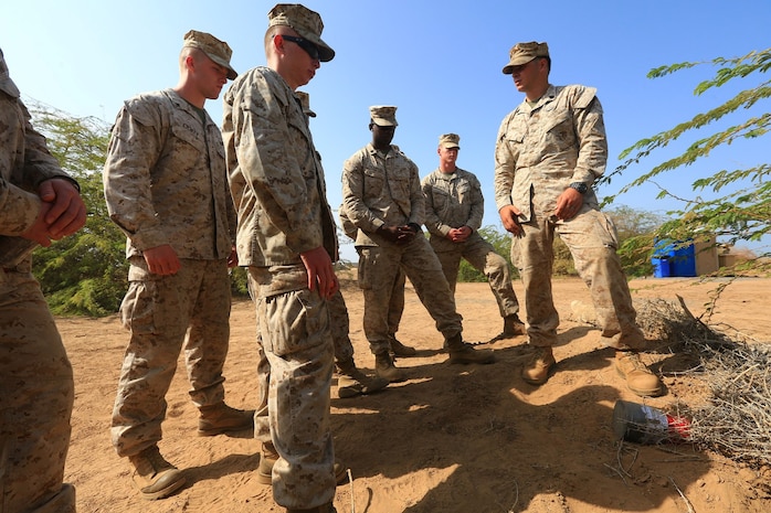 CAMP LEMONNIER, DJIBOUTI (Jan. 10, 2014)  – U.S. Marine Corps Staff Sgt. Jordan Torcello, an explosive ordnance team leader assigned to Explosive Ordnance Detachment, 13th Marine Expeditionary Unit, teaches Marines from Charlie Company, 13th MEU, the properties of a directional fragmentation charge during counter improvised explosive device (IED) training at Camp Lemonnier, Djibouti Jan. 10, 2014.  Approximately 50 Marines assigned to Charlie Company, 13th MEU completed counter IED training, which covered a wide variety of techniques to defeat enemy IEDs. The 13th MEU is deployed with the Boxer Amphibious Ready Group as a theater reserve and crisis response force throughout the U.S. 5th Fleet area of responsibility.  (U.S. Marine Corps photo by Staff Sgt. Matt Orr/Released)