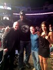 A U.S. Marine (right center) poses with Dana White (left), President of mixed martial arts organization the Ultimate Fighting Championship, Shaquille “Shaq” O'Neal, a former National Basketball Association player, and Julianna ‘The Venezuelan Vixen’ Pena (right), the ultimate fighter season 18 champion, at a UFC fight cage side. This Marine was able to attend the fight and meet these famous individuals through the program called America’s Heroes Enjoying Recreation Outdoors Foundation, A HERO, supporting veterans to continue the healing process, so they can focus on their future and reconcile the traumatic events of their past in a healthy and constructive environment. 