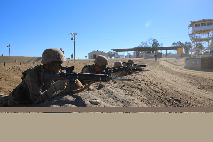 Marines of Company C, 1st Recruit Training Battalion, regroup and get ready to go through the rest of the course during Copeland’s Assault, Jan. 15. The course was equipped with simulated machine gun fire and mortar explosions to make it seem more realistic.   