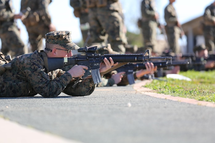 Recruits of Company E, 2nd Recruit Training Battalion, practice their prone shooting position during Grass Week aboard Edson Range, Jan 15. During Grass Week, recruits learned the basic fundamentals of marksman shooting skills and functions of the rifle.