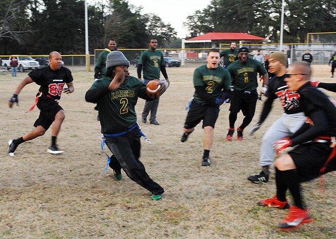 Immortals tailback Travis Phillips sprints to gain a few yards for his team during Marine Corps Logistics Base Albany’s Intramural Flag Football Tournament, Jan. 24.