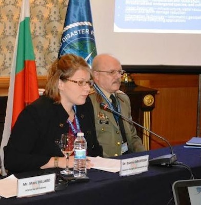 Col. Mitko Stoykov, director of NATO Crisis Management and Disaster Response Centre of Excellence, right, directed the question and answer session for EL’s Dr. Sandra Brasfield at the Dec. 11 technology demonstration for the European Command (EUCOM) and EUCOM Defense Environmental International Cooperation program conference in Sofia, Bulgaria. 