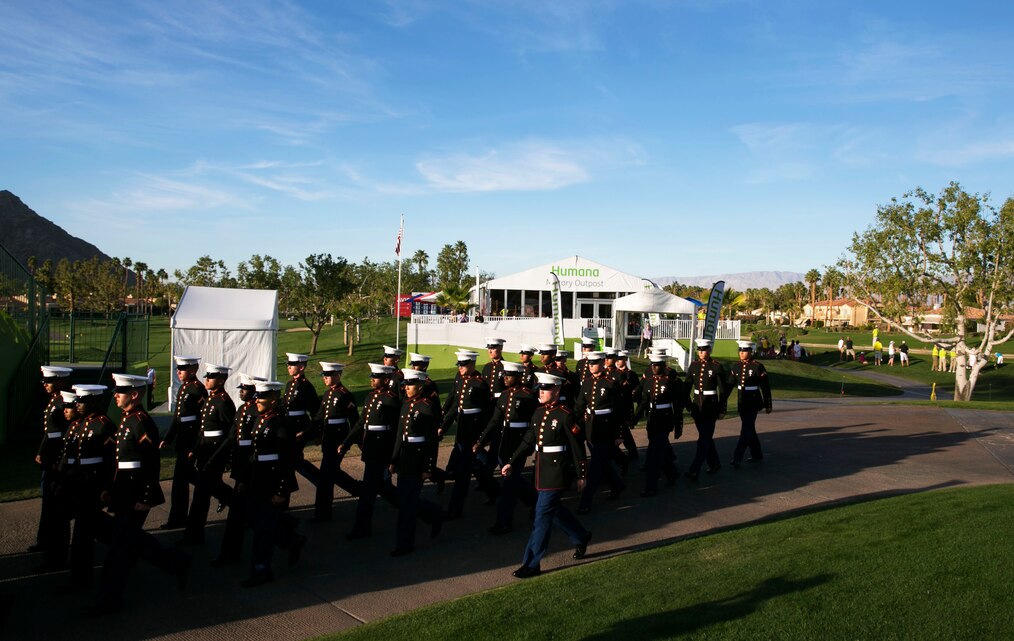 Students with the Marine Corps Communication-Electronics School march to the 18th green at the Professional Golfers’ Association of America Tour West in La Quinta, Calif., Jan. 18, during the Humana Challenge Military Appreciation Day. During the ceremony, active-duty service members and veterans were acknowledged for their service, and a mortgage-free home was presented to a wounded combat veteran. (Official Marine Corps Photo By Lance Cpl. Kasey Peacock/Released)