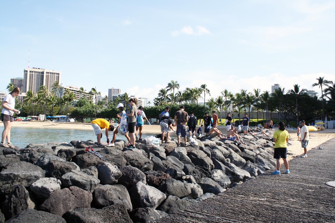 Approximately 20 volunteers from the Punahou Junior ROTC program (which includes cadets from other area high schools and some home-schooled students) and Corps’ employees and family members joined forces April 27 to clean up the beach and berm area and plant decorative plants (photo below, right) provided by the Hale Koa Hotel at the Corps’ Pacific Regional Visitor Center at Fort DeRussy in Waikiki. Altogether about 50 volunteers participated. Photo by Joseph Bonfiglio 