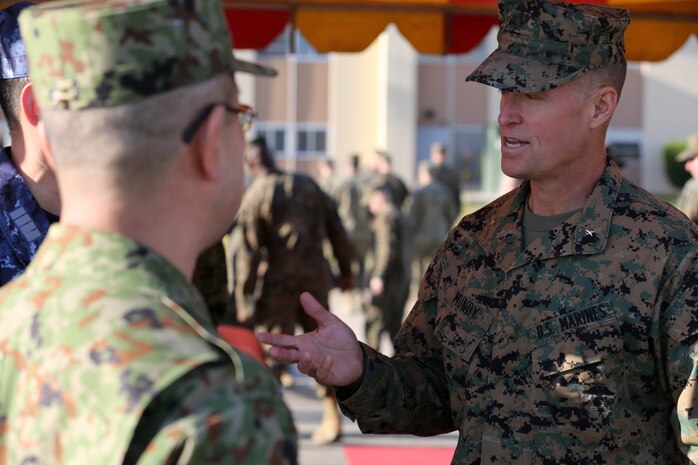 U.S. Marine Brig. Gen. Carl E. Mundy III, right, deputy commanding general, I Marine Expeditionary Force, speaks with officials from the Japan Ground Self-Defense Force moments after the opening ceremony of Exercise Iron Fist 2014 aboard Camp Pendleton, Calif., Jan. 23, 2014. Iron Fist is an amphibious exercise that brings together Marines and sailors from the 15th Marine Expeditionary Unit, other I MEF units, and soldiers from the JGSDF, to promote military interoperability and hone individual and small-unit skills through challenging, complex and realistic training. (U.S. Marine Corps photo by Lance Cpl. Ricardo Hurtado/Released)