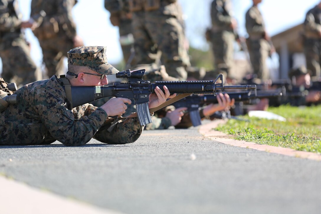 Recruits of Company E, 2nd Recruit Training Battalion, practice their prone shooting position during Grass Week aboard Edson Range, Jan 15. During Grass Week, recruits learned the basic fundamentals of marksman shooting skills and functions of the rifle.