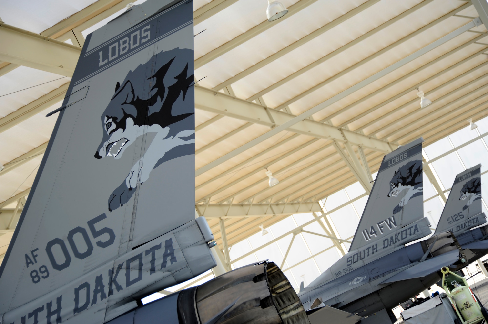 F-16 Fighter Falcons from the South Dakota Air National Guard sit under sunshades while maintainers and pilots prepare for take-off at Davis-Monthan Air Force Base, Ariz., Jan. 23, 2013. Ten F-16s and 150 Guardsmen from Joe Foss Field in Sioux Falls, S.D. arrived at D-M Jan. 11 for Operation Snowbird to conduct two weeks of mandatory training. (U.S. Air Force photo by Airman 1st Class Betty R. Chevalier/released)