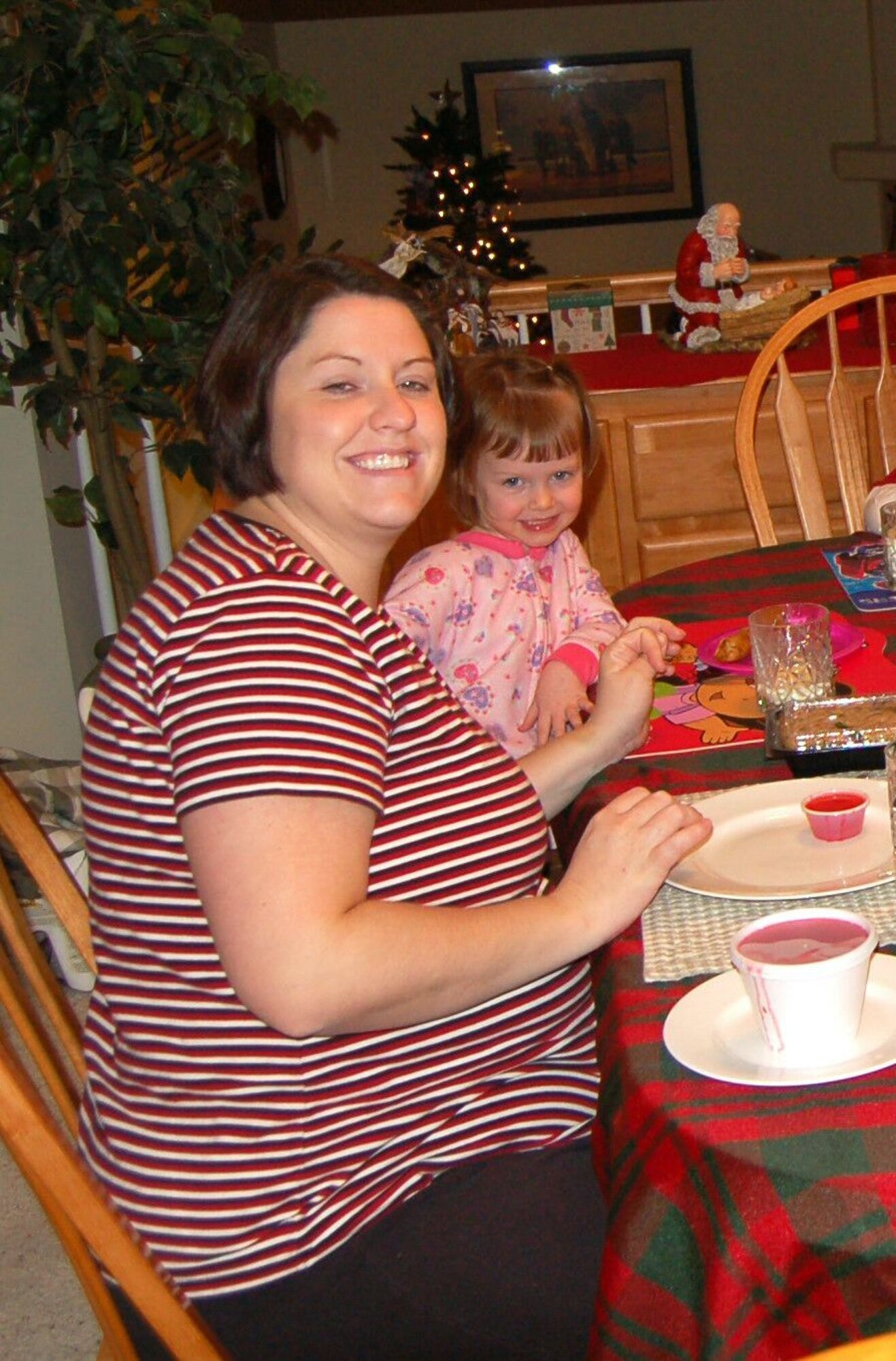 Luella Moore, wife of Tech. Sgt. Benjamin Moore, 41st Electronic Component Squadron, poses with her daughter in a photo before her change to a more health-conscious lifestyle.  After losing weight, Luella decided to apply to be a cast member of the reality TV game show, “Survivor,” that she has been a fan of for more than 10 years. (Courtesy Photo)