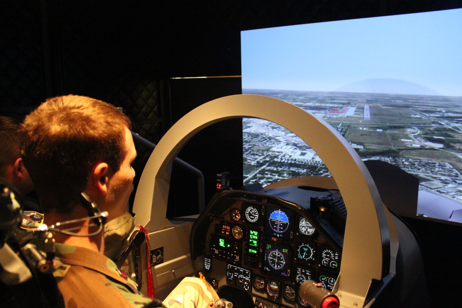Civil Air Patrol Cadet Stephen Clark demonstrates his skills on a visual approach on the T-6 simulator on Joint Base San Antonio-Randolph Dec. 11.  (U.S. Air Force photo by Lt. Col. Andreas K. Wesemann) (Released)