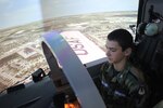 Civil Air Patrol Cadet Stephen Spalding learns how to fly an aircraft on the T-6 simulator on Joint Base San Antonio-Randolph Dec. 11.  (U.S. Air Force photo by Lt. Col. Andreas K. Wesemann) (Released)