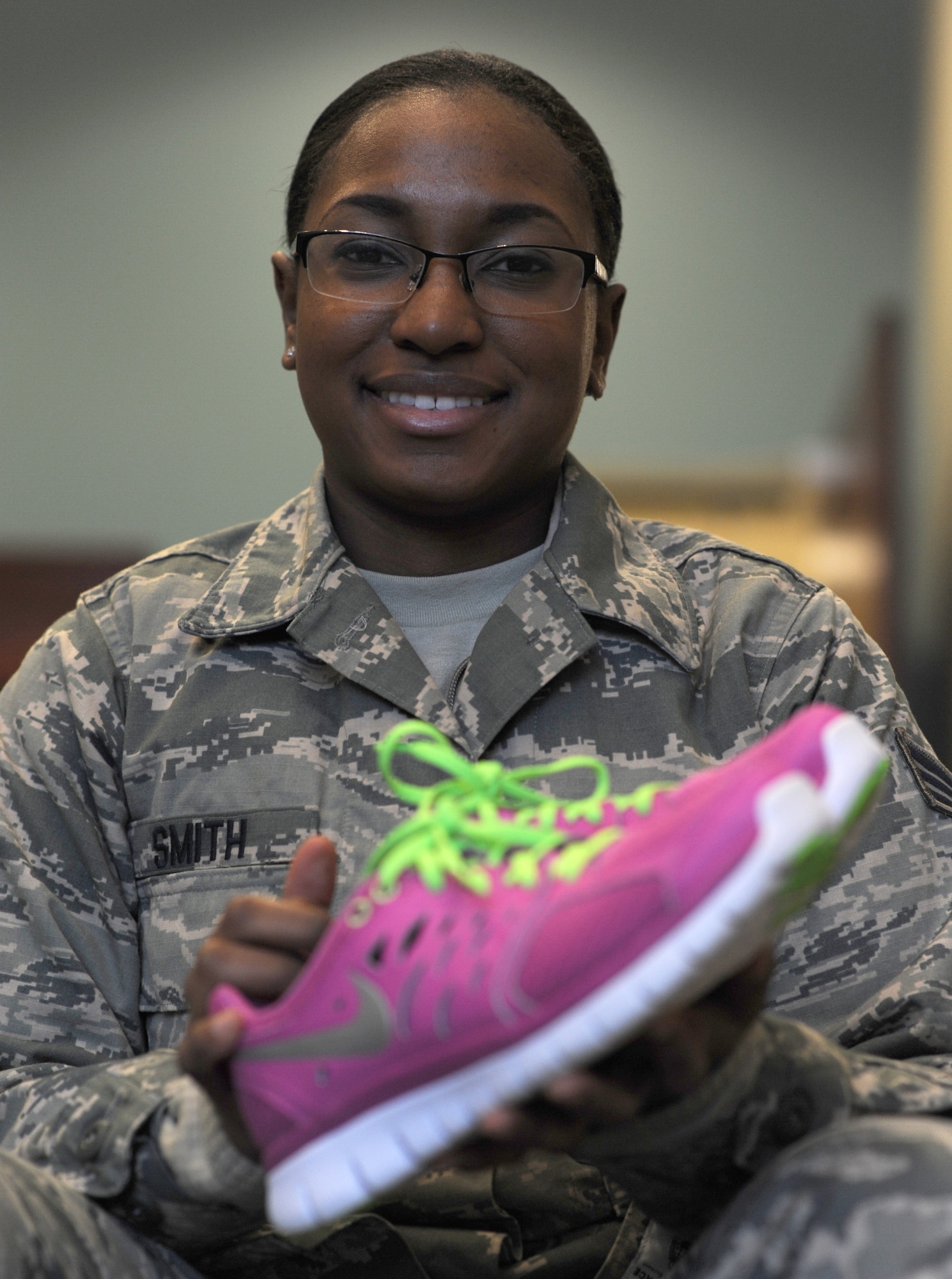 “I’m really excited to wear colored shoes. As soon as I read the [Air Force Instruction] change I went to the mall and bought a bright pink pair of running shoes,” said Senior Airman Rashana Smith, 366th Logistics Readiness Squadron assistant to commanders support staff. The revision to AFI 36-2903 paragraph 7.1.6.2. states, “There are no restrictions on the color of the athletic shoes.” (U.S. Air Force photo by Airman 1st Class Brittany A. Chase/Released)