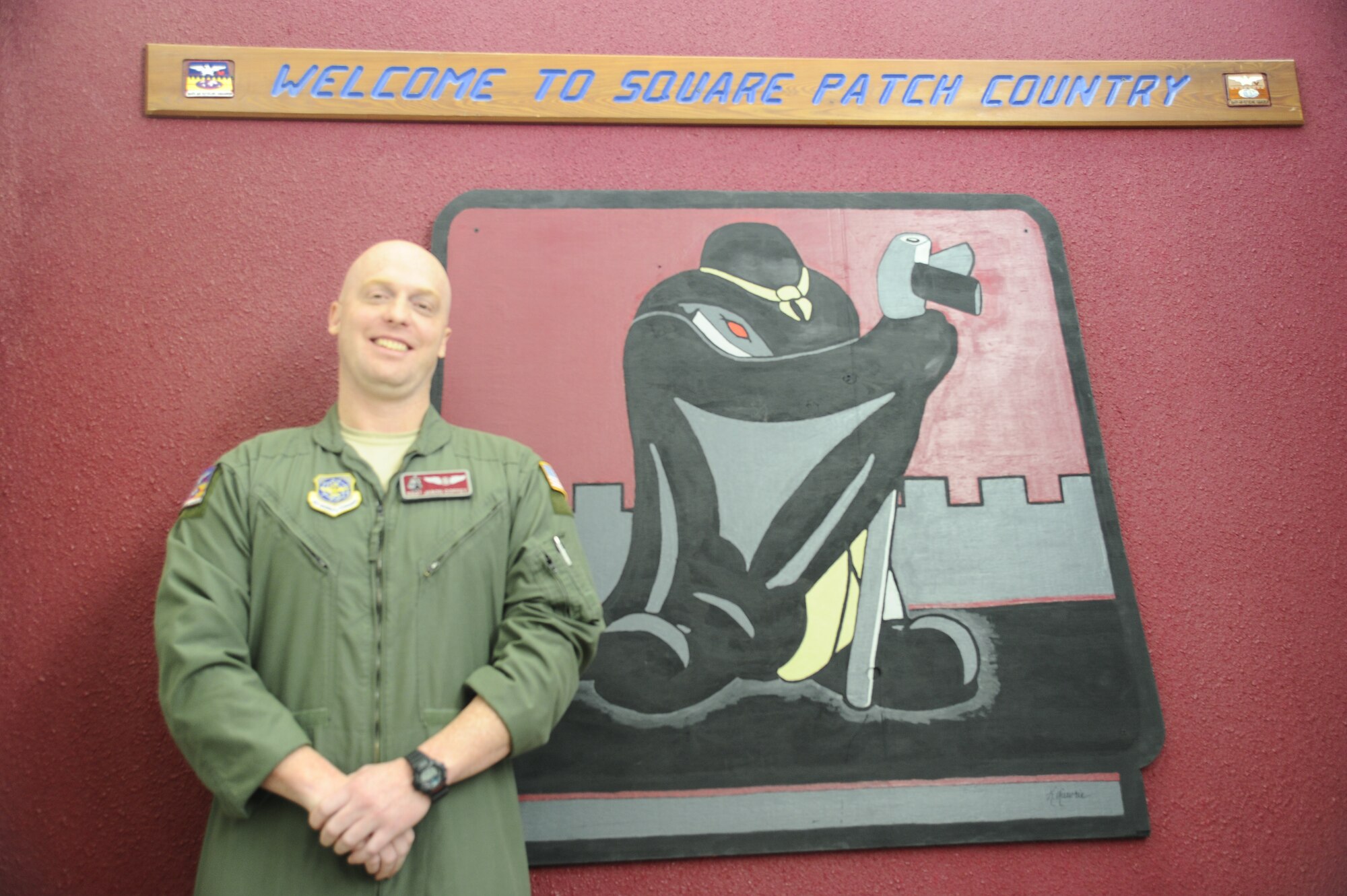 Staff Sgt. Jason Coffey, 384th Air Refueling Squadron scheduling NCO in charge, stands by his squadron patch Jan. 16. Coffey was selected as the spotlight performer for the week of Jan. 20 through 24 because of his work ethic and dedication to the wing’s mission. (U.S. Air Force photo/Airman 1st Class David Bernal Del Agua)