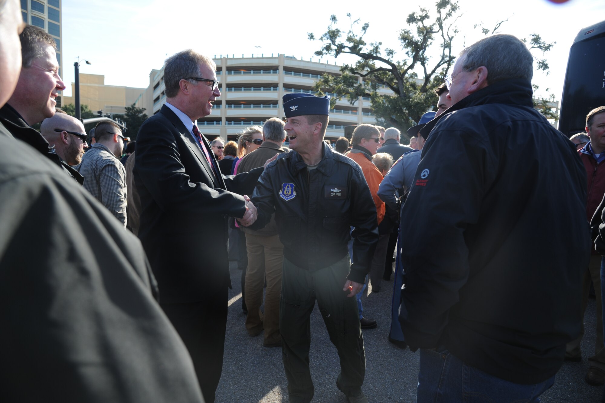 Vincent Creel, city of Biloxi Public Affairs manager, thanks Col. Frank Amodeo, 403rd Wing commander, for attending the Biloxi baseball stadium groundbreaking ceremony Jan. 23, 2014, at the corner of Caillavet Street and Highway 90, Biloxi, Miss.  The proposed completion date of the stadium is the beginning of the 2015 baseball season.   (U.S. Air Force photo by Kemberly Groue)
