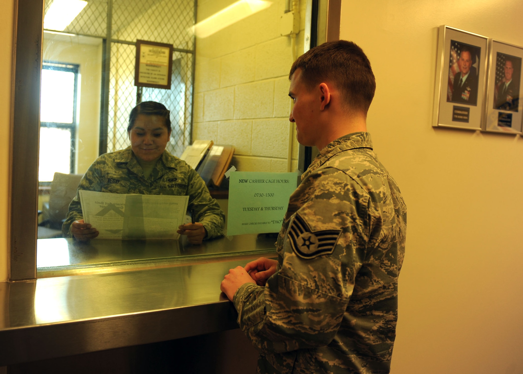 U.S. Air Force Airman 1st Class Tiffany Begay, left, 7th Comptroller Squadron customer service technician, trains with Staff Sgt. Michael Hatfield, 7th CPTS budget analyst, in the disbursing office Jan. 21, 2014, at Dyess Air Force Base, Texas. The 7th CPTS was recently selected by Air Combat Command as the Maj. Gen. Alfred K. Flowers Comptroller Squadron of the Year and the Financial Services Office of the Year award winner during the 2013 financial Management and Comptroller Annual Awards. (U.S. Air Force photo by Airman 1st Class Autumn Velez/Released)