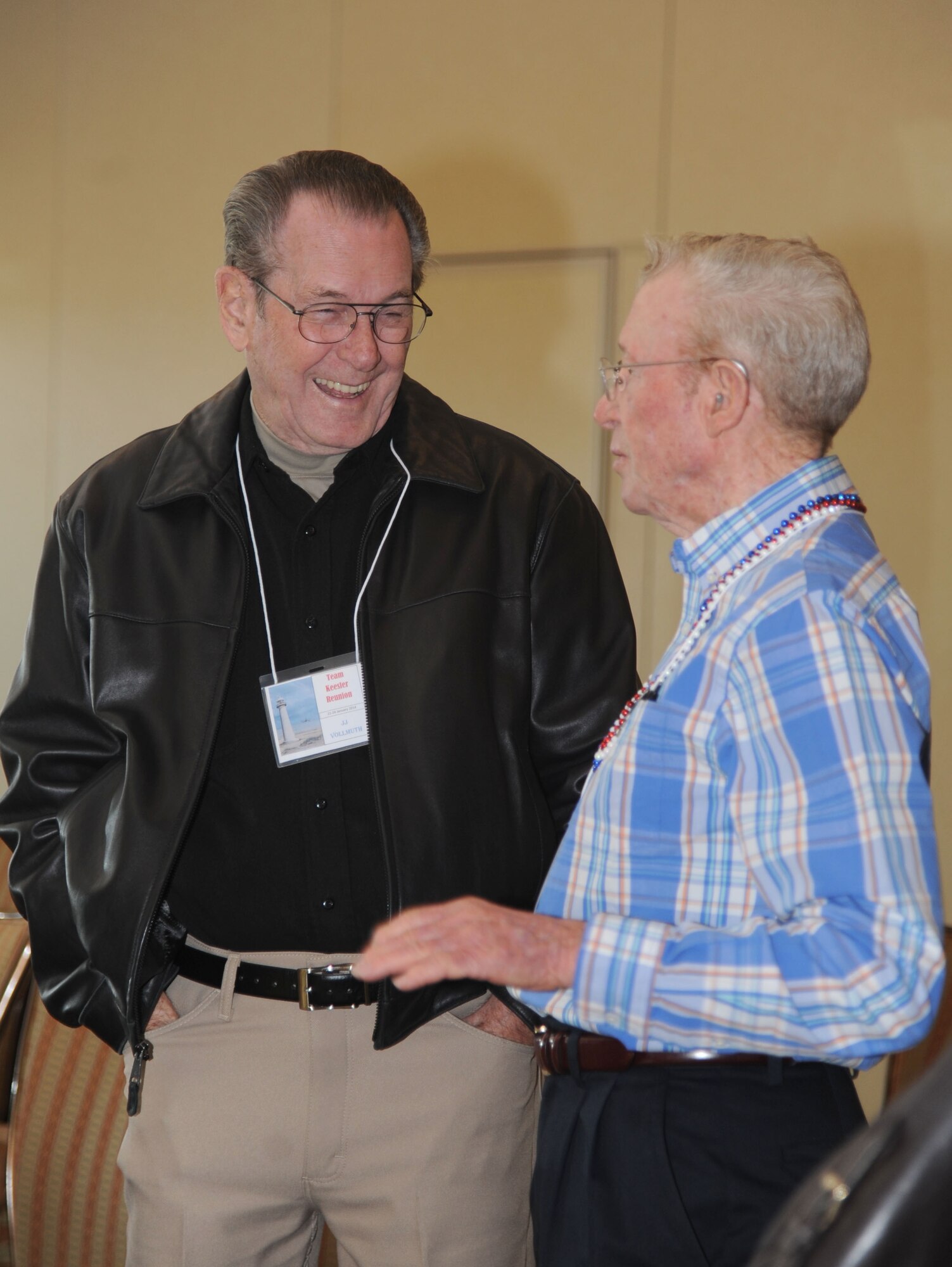 Retired Chief Master Sgt. J.J. Vollmuth, former Keesler senior enlisted advisor, has a laugh with Retired Col. Dick O’Grady, former Keesler vice commander, during a reunion of former Keesler leaders Jan. 22, 2014, at the Bay Breeze Event Center, Keesler Air Force Base, Miss.  The reunion included leaders who were assigned to Keesler during Hurricane Elena.  (U.S. Air Force photo by Kemberly Groue)