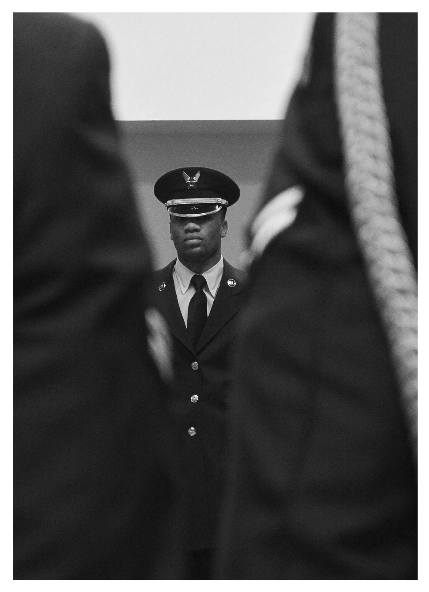 A member of the base honor guard is reflected in a mirror as he stands at attention during a uniform inspection, Dec. 18 at Tyndall. The base honor guard is comprised of volunteer Airmen from a wide variety of Air Force Specialty codes and units. (U.S. Air Force photo illustration by Staff Sgt. Javier Cruz) 