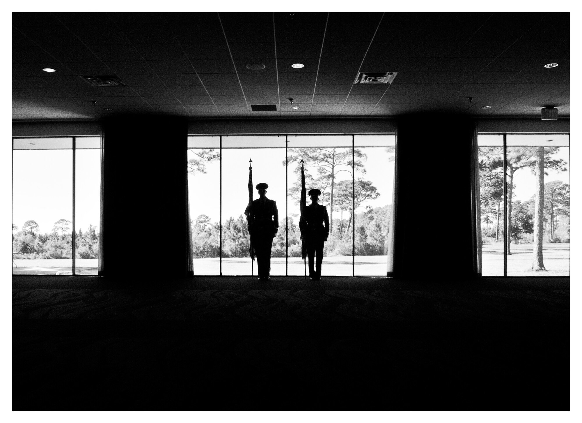 Members of the base honor guard stand perfectly still during a practice before the opening of an official ceremony, Dec. 18 at Tyndall. The base honor guard’s primary mission is to provide military funeral honors for active duty, retiree and veteran members, who served honorably in the United States Air Force and Army Air Corp. (U.S. Air Force photo illustration by Staff Sgt. Javier Cruz)