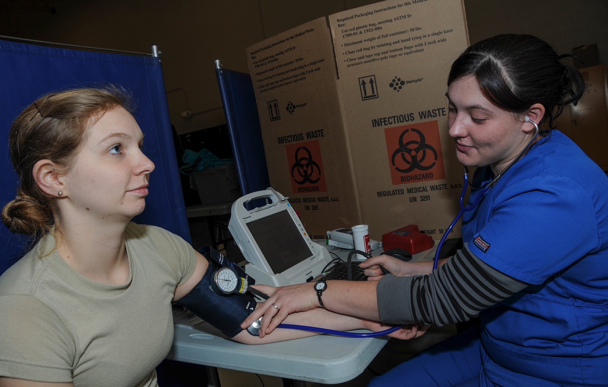 Senior Airman Michelle Dahlberg, 911th Aeromedical Staging Squadron medical technician, has her blood pressure checked by Tara Hood, Central Blood Bank phlebotomist, during a blood drive, Jan. 12, 2014 at the Pittsburgh International Airport Air Reserve Station. A donor’s diastolic blood pressure must be less than 100 mm Hg before they are allowed to donate blood. Every pint of blood donated can save up to three lives. (U.S. Air Force photo by Senior Airman Joshua J. Seybert)