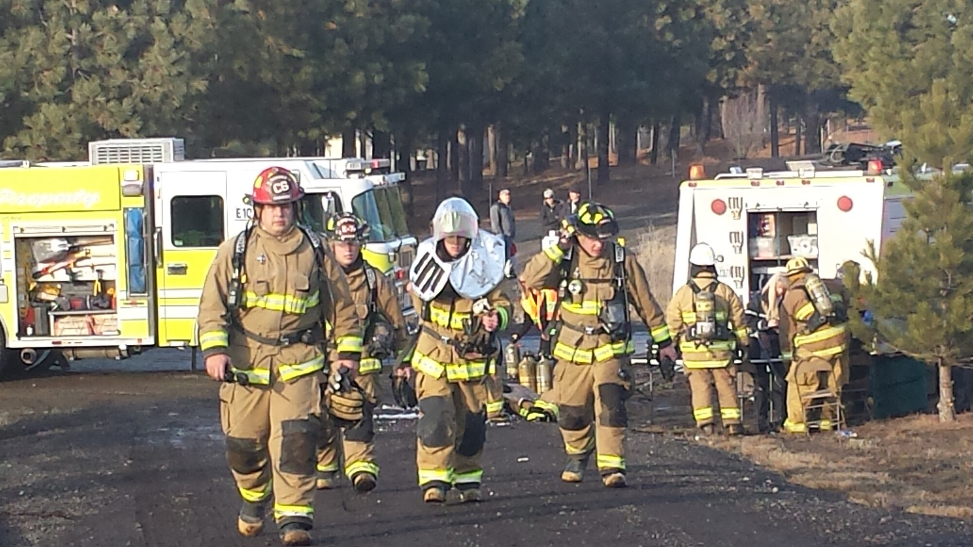 Fairchild firefighters from the 92nd Civil Engineering Squadron arrive on scene at on off-base house fire Jan. 15, 2014. They were requested by Spokane Fire Department, District 10 to mutually aide in firefighting efforts. (U.S. Air Force photo by Kimo Kuheana)