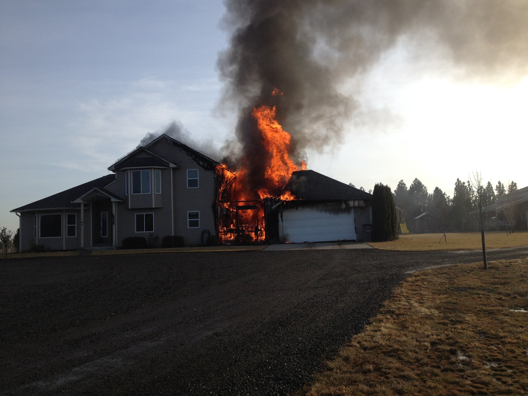 A Residential home is on fire thee miles north of Fairchild Air Force Base. Firefighters from the 92nd Civil Engineering Squadron responded to the fire to mutually aide in the fire with Spokane Fire Department District 10. They responded with two crews, an Engine and a Mobile Water Supply Vehicle. (Courtesy photo) 