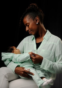 Working mother Amber Russell looks down at her two-month-old daughter Zoe Lynn, Jan 16. Room 2036 is now available in the Jones Building, Joint Base Andrews, Md, for nursing moms like Russell to express milk. Those with a need to use the room should contact the facility manager on the first floor, room 1754, to have their common access card-enabled. (U.S. Air Force photo by Staff Sgt. Lauren Main)