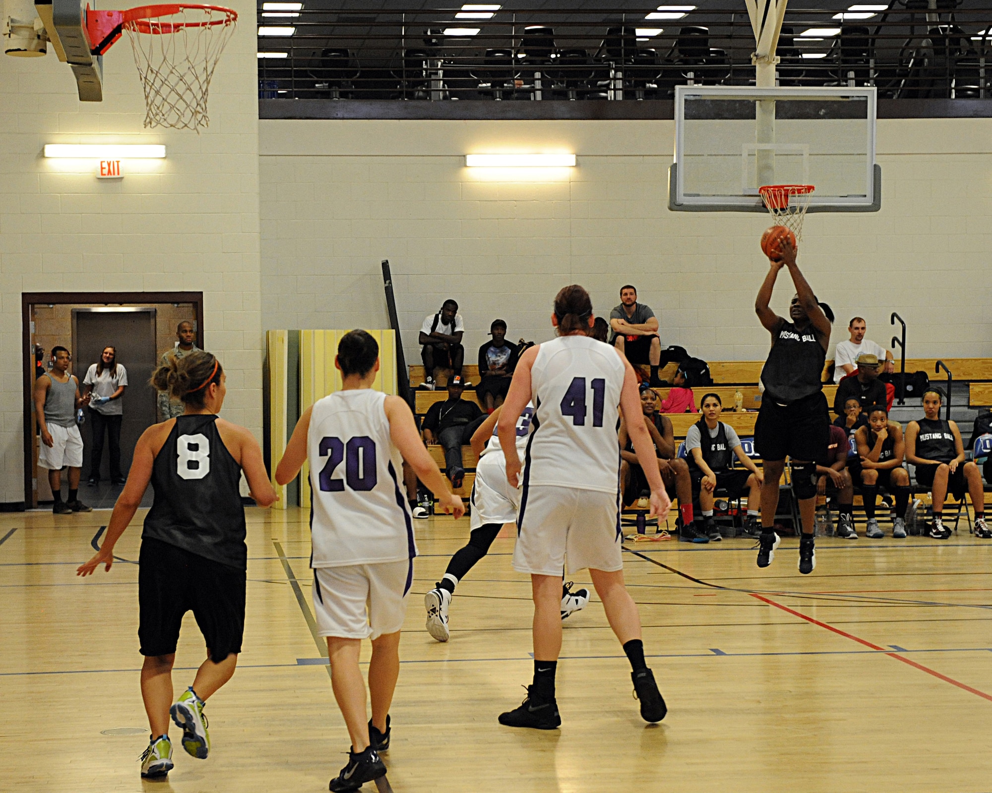 D-M Mustangs player Denisha Fields, civilian, attempts a three-point shot against the Phoenix Venom during the Martin Luther King Jr. Women's Basketball Tournament at Davis-Monthan Air Force Base, Ariz., Jan. 18, 2014. The D-M Mustangs went on to win against the Phoenix Venom, 48-42. (U.S. Air Force photo by Airman 1st Class Chris Drzazgowski/Released)