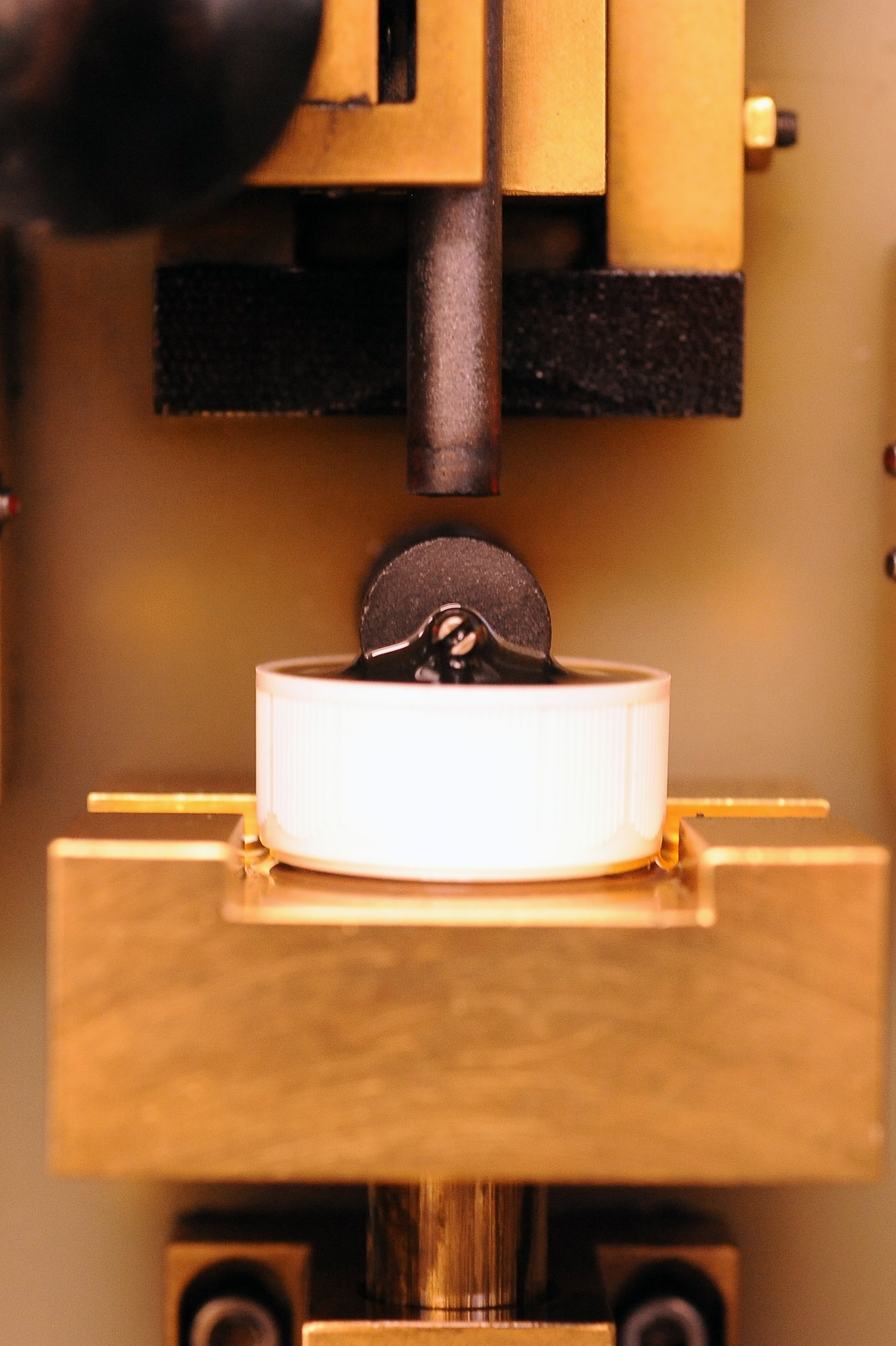 An engine oil sample on the test stand is ready for analysis Jan. 15 at Luke Air Force Base. Samples of oil are tested for abnormal metals that could be from excessive engine wear. (U.S. Air Force photo/Airman 1st Class Pedro Mota