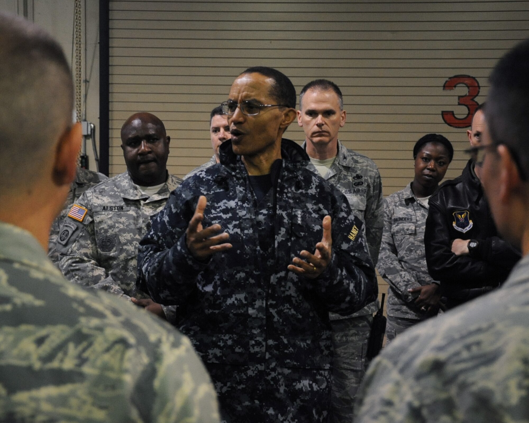 Adm. Cecil D. Haney, U.S. Strategic Command commander, speaks with Airmen from the 2nd Maintenance Group on Barksdale Air Force Base, La., Jan. 23, 2014. Haney's travel to Barksdale was the latest stop in a series of ongoing visits to bases with nuclear deterrent forces. Admiral Haney observed training and operations and met with personnel, discussing the importance of the triad and thanking Airmen for their service and contributions to our nation's nuclear deterrence mission.   (U.S. Air Force photo/Staff Sgt. Sean Martin)


