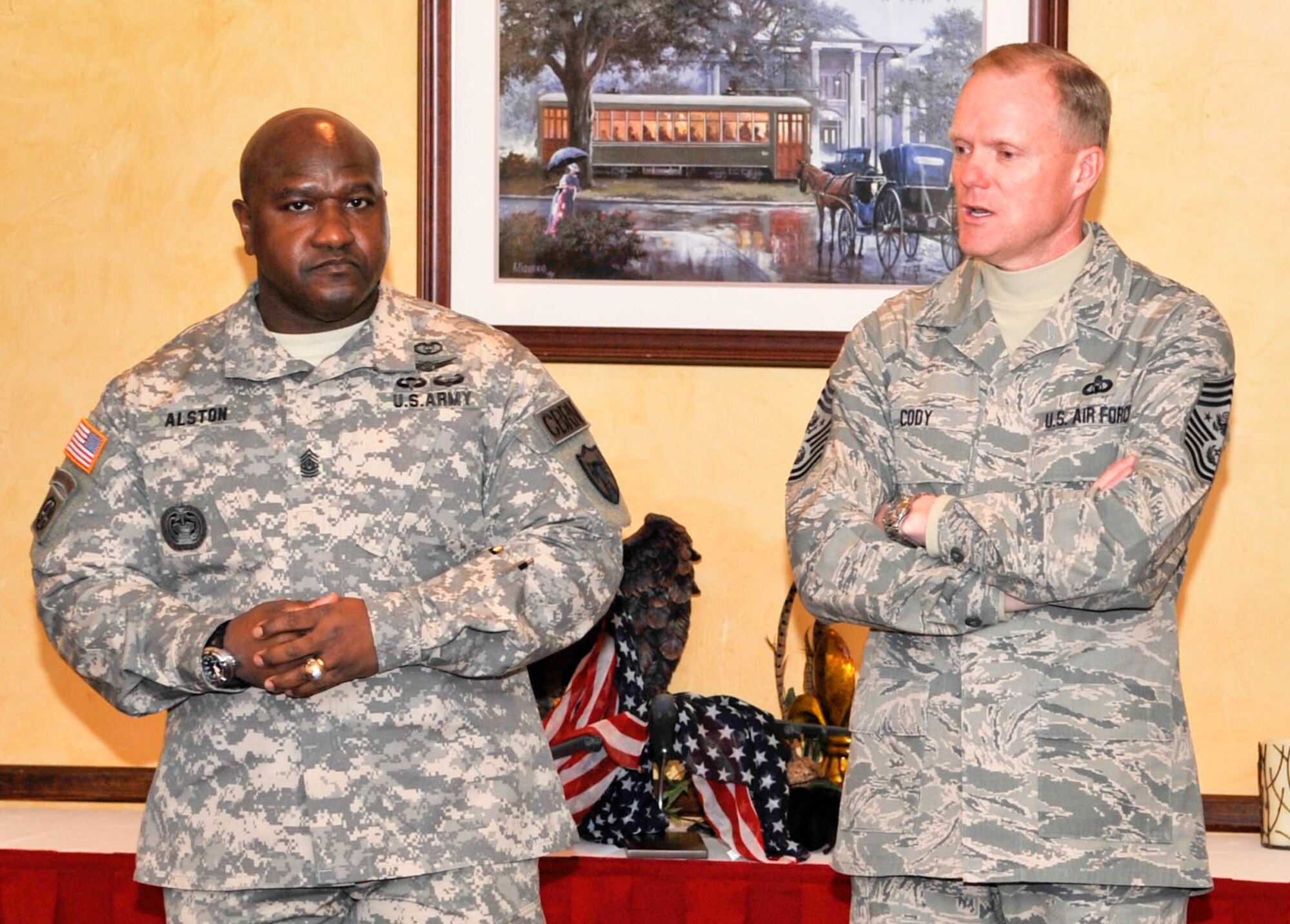 Command Sgt. Maj. Patrick Alston, left, U.S. Strategic Command senior enlisted advisor, and Chief Master Sgt. of the Air Force James A. Cody speak with company grade officers and senior noncommissioned officers during a luncheon at the Barksdale Club on Barksdale Air Force Base, La., Jan. 23, 2014. Both senior enlisted leaders met with Airmen to share their views on the challenges and opportunities in today's Air Force. (U.S. Air Force photo/Airman 1st Class Benjamin Raughton)

