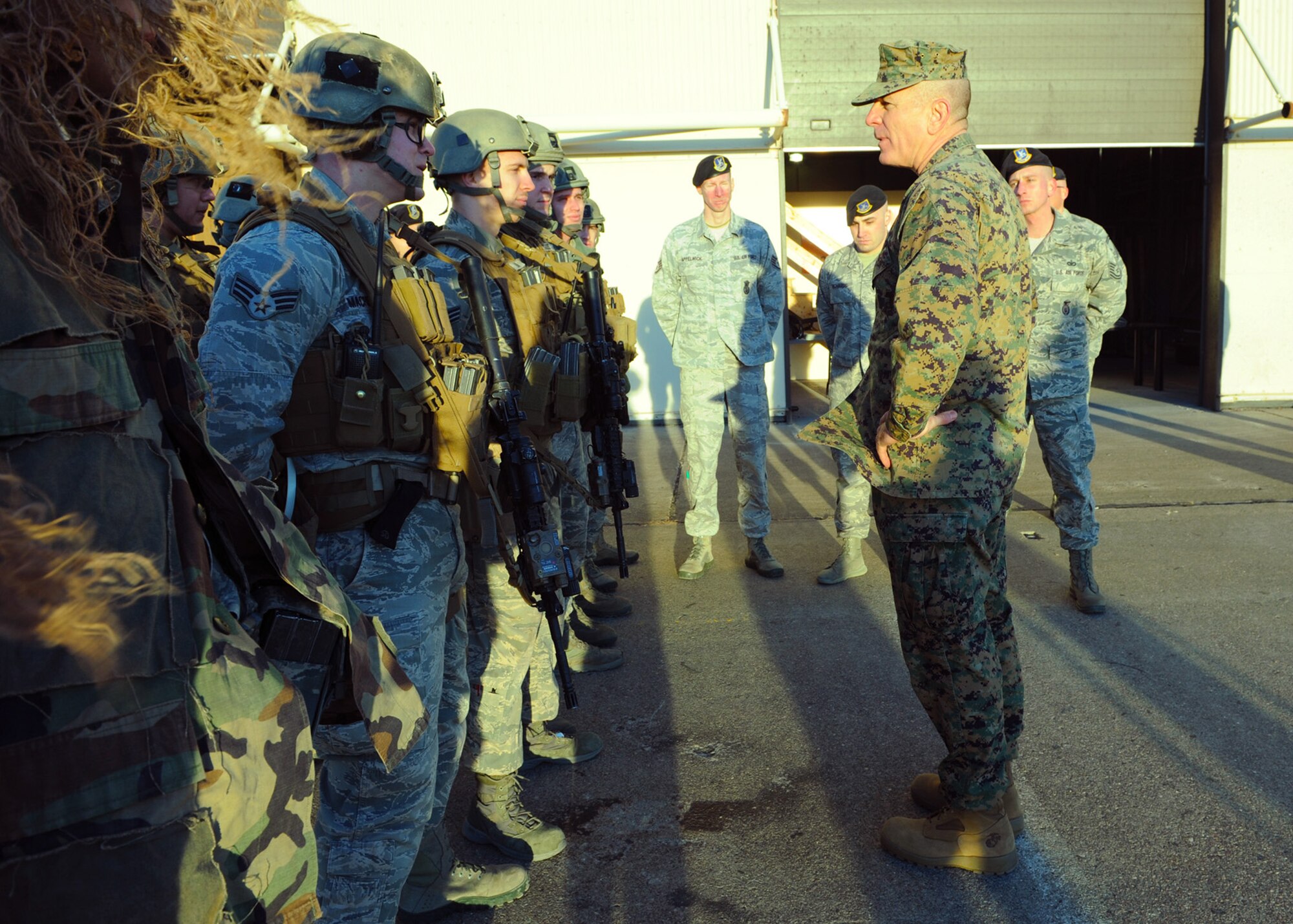Marine Corps Sgt. Maj. Bryan B. Battaglia, the senior enlisted advisor to the chairman of the Joint Chiefs of Staff, talks to 341st Security Forces Group Tactical Response Force members in formation at the TRF shoot house Jan. 17. Battaglia visited Malmstrom Air Force Base, Mont., Jan. 15 to 18 to meet with enlisted Airmen and their families, and Great Falls community members. (U.S. Air Force photo/Senior Katrina Heikkinen)