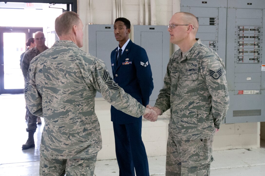 Chief Master Sgt. of the Air Force James Cody greets one of the 126th Air Refueling Wing's Outstanding Airman of the Year, Staff Sgt. Jason Soles, a member of the 126th Civil Engineer Squadron, at Scott Air Force Base, Ill., Jan. 16, 2014. Cody stopped by the 126th Air Refueling Wing, Illinois Air National Guard, for a visit during his time at Scott Air Force Base. (Air National Guard photo by Senior Airman Cesaron White)