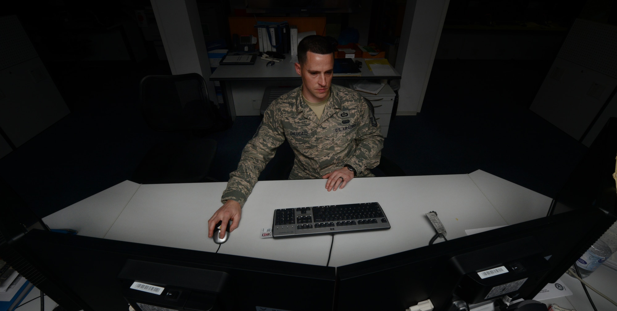 Master Sgt. Matthew DeLuca, 21st Operational Weather Squadron flight chief, preforms a quality check on a joint operation area forecaster Jan. 23, 2014, Ramstein Air Base, Germany. The 21st OWS track weather patterns to provide commanders and operators with accurate, timely and relevant support for joint and combined operations across U.S. European Command and U.S. Africa Command to ensure the safety of cargo, aircraft and lives. (U.S. Air Force photo/Airman Dymekre Allen)