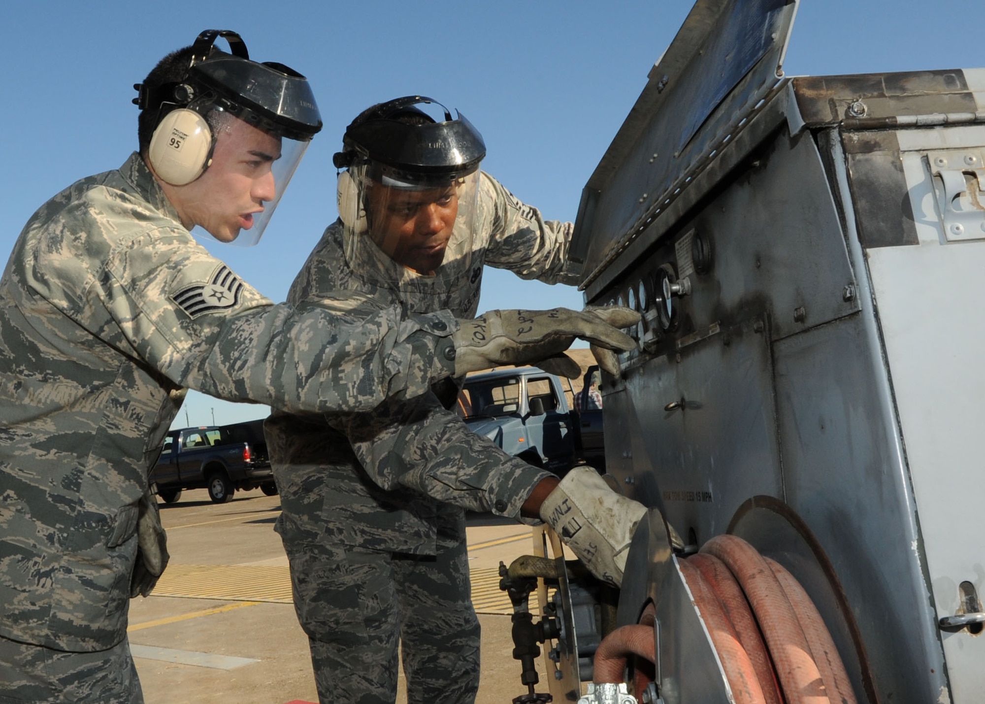 Staff Sgt. Jesus Casillas, 39th Maintenance Squadron, Crash Disabled Damaged Aircraft Recovery team member, discusses the process of inflating a pneumatic airbag with Chief Master Sgt. Anthony Johnson, 39th ABW command chief, Jan. 23, 2014, here.  Airmen with the CDDAR team demonstrated the squadrons Crash Disabled Damaged Aircraft Repair capability. (U.S. Air Force photo by Staff Sgt. Veronica Pierce/Released) 