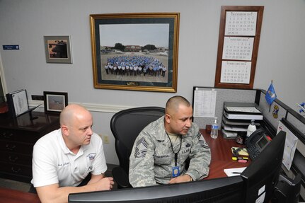 Air Force Chief Master Sgt. Paul Figueroa (right), Headquarters Air Education and Training Command inspector general superintendent, inspects the work of Paul Wieland, 12th Flying Training Wing Maintenance Directorate program manager, Jan.15 during the 12th FTW’s 2014 Headquarters AETC’s Combined Unit Inspection. (U.S. Air Force photo by Melissa Peterson)