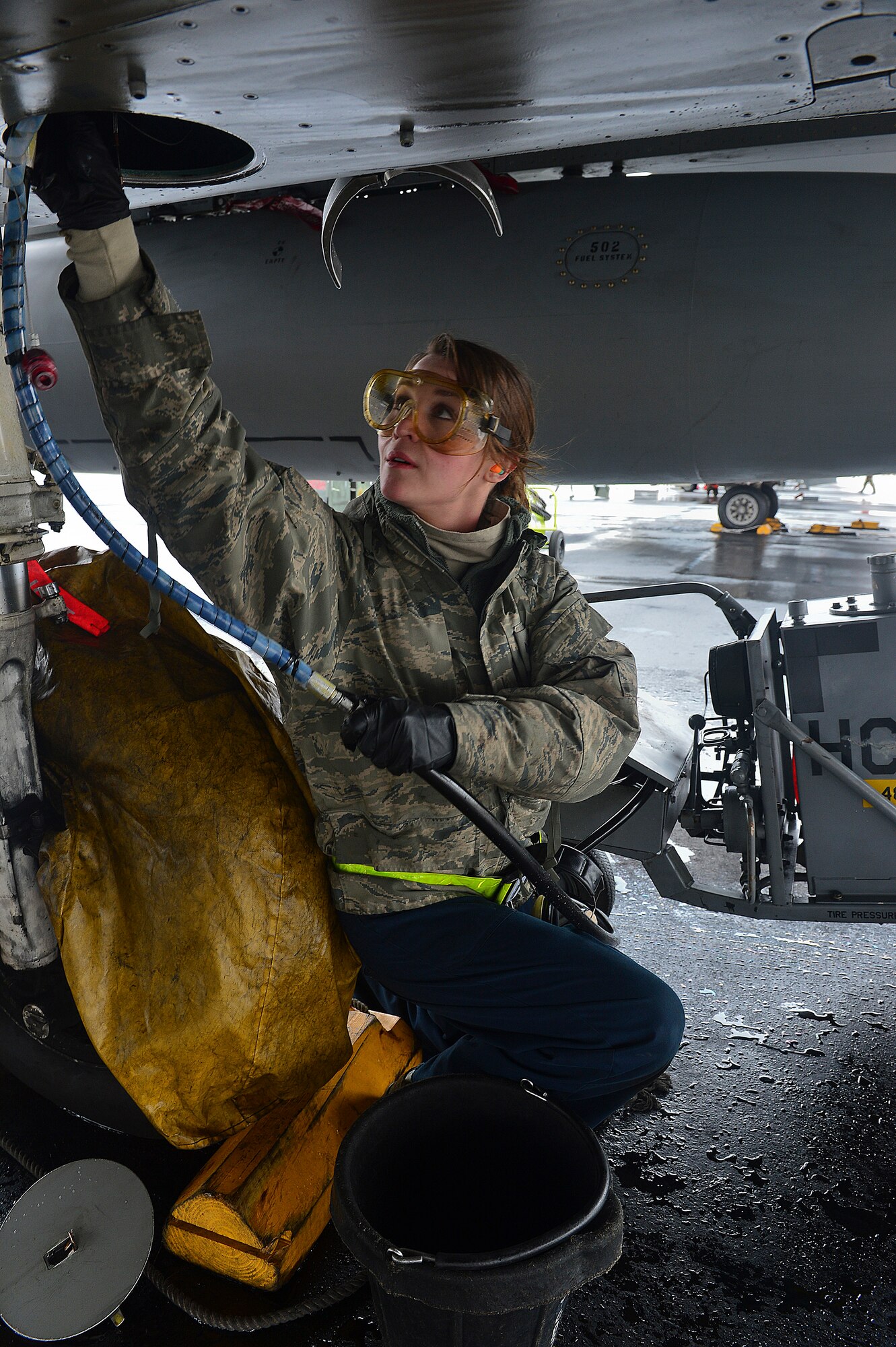 Staff Sgt. Carrie Quinn, 748th Aircraft Maintenance Squadron dedicated crew chief,  checks the engine oil of an F-15C Eagle during the Tactical Leadership Program at Albacete Air Base, Spain Jan. 22, 2014. The 493rd Fighter Squadron from Royal Air Force Lakenheath, England is participating in the multi-national program, which develops key leadership and mission-planning skills needed for NATO operations. (U.S. Air Force photo by Staff Sgt. Stephanie Mancha/Released)