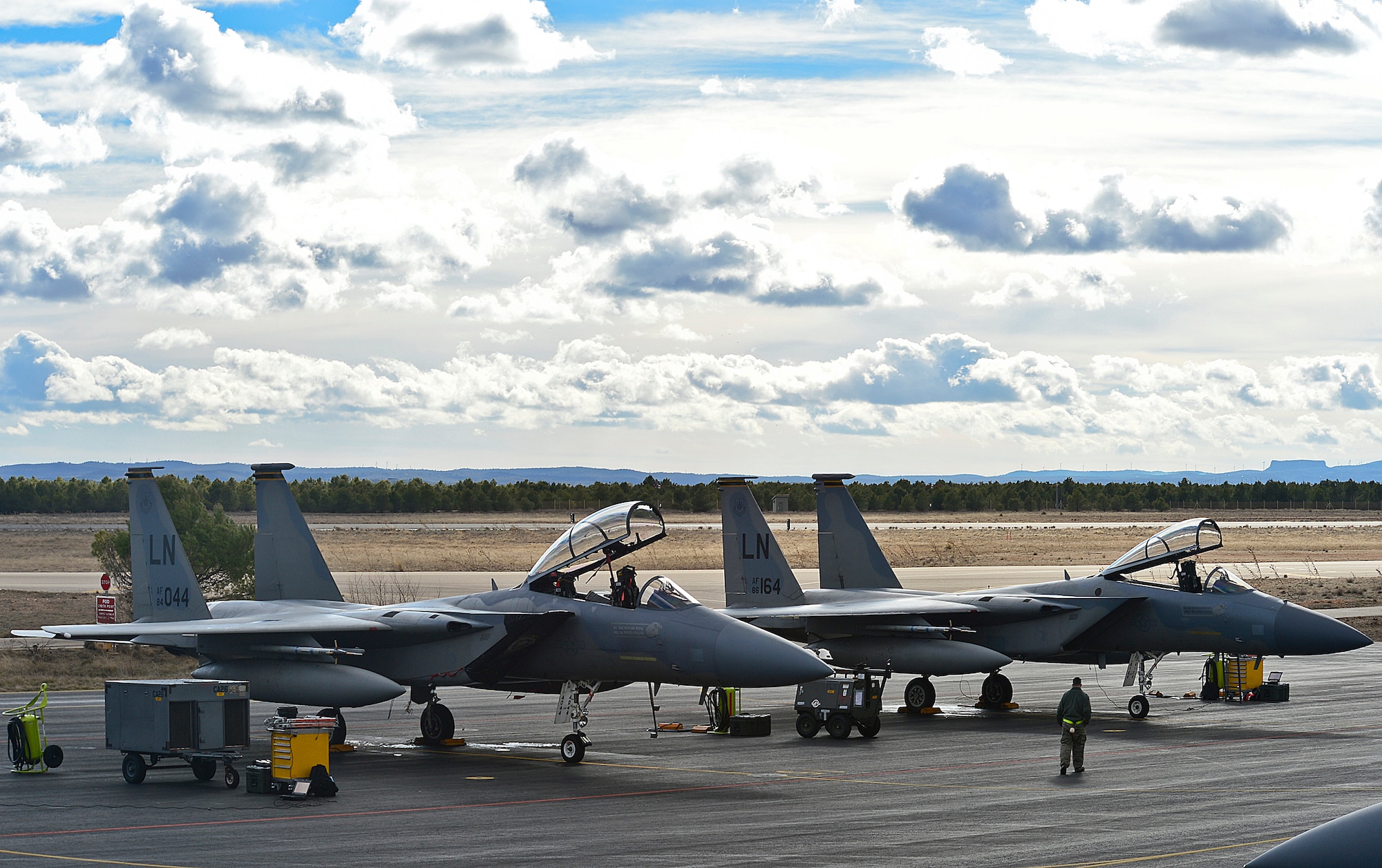 Two F-15C Eagles from the 493rd Fighter Squadron are checked prior to take-off during the Tactical Leadership Program at Albacete  Air Base, Spain Jan. 20, 2014. The 493rd FS from Royal Air Force Lakenheath, England is participating in the multi-national program, which develops key leadership and mission-planning skills needed for NATO operations. (U.S. Air Force photo by Staff Sgt. Stephanie Mancha/Released)