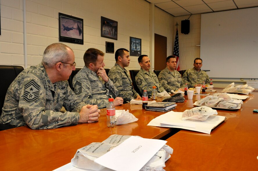 Chief Master Sgt. James Morris, 86th Airlift Wing command chief, eats lunch with Airmen of the 86th Material Maintenance Squadron after the command chief’s immersion tour of the Central Regional Storage Facility, Jan. 14, 2014, Sanem, Luxembourg. The immersion tour gave the enlisted leadership a better understanding of what the CRSF mission is and what roles the 86th Material Maintenance Squadron Airmen have.  (U.S. Air Force photo/Staff Sgt. Leslie Keopka)