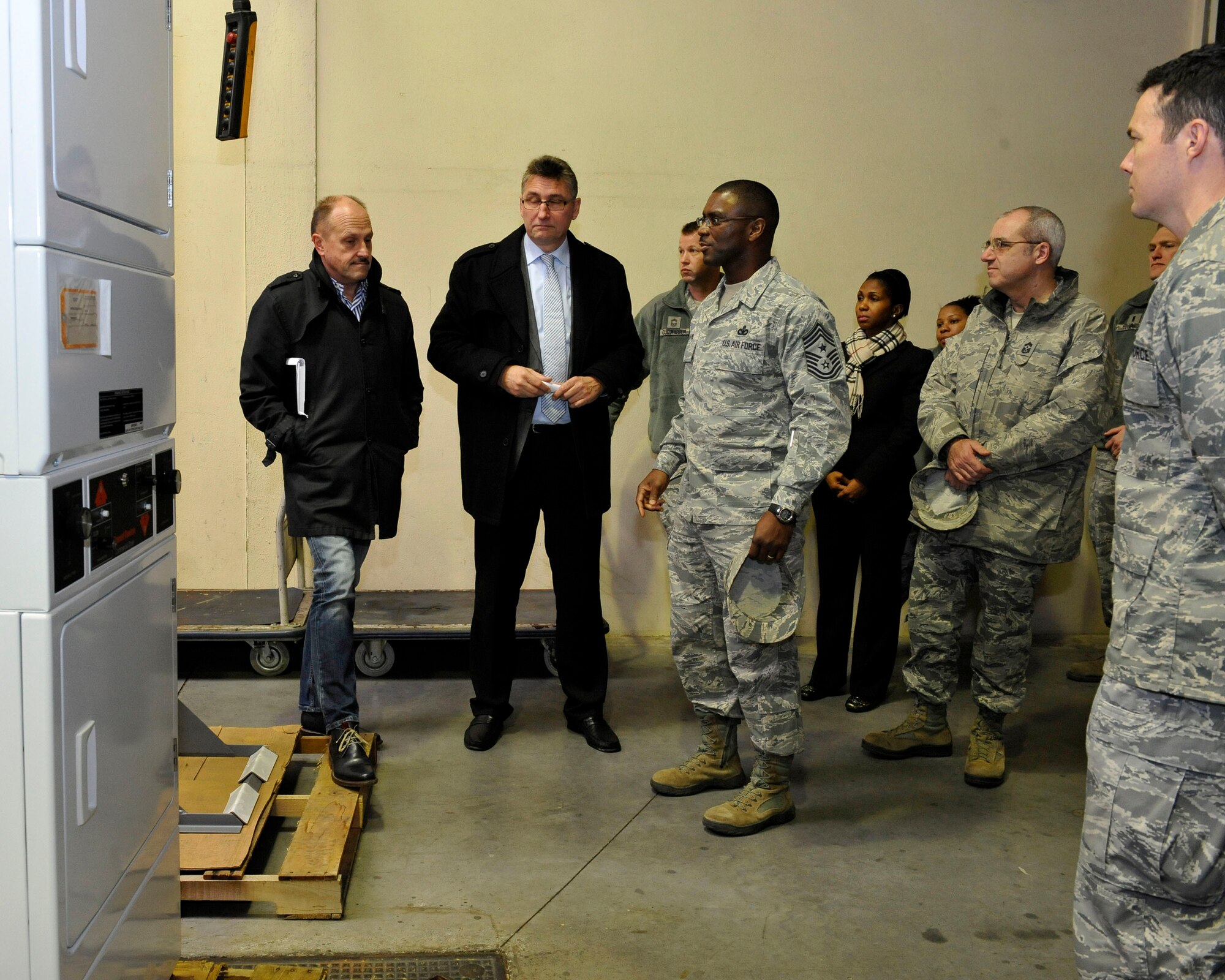 Chief Master Sgt. James Davis, U.S. Air Forces in Europe and U.S. Air Forces Africa command chief, and Chief Master Sgt. James Morris, 86th Airlift Wing command chief, receive a tour of the Central Regional Storage Facility site, Jan. 14, 2014, Sanem, Luxembourg. The CRSF site is the sole Department of Defense presence in Luxembourg and it stores Air Force equipment, including military vehicles, fuel systems, Basic Equipment Airfield Requirement kits, fire trucks and fire extinguishers. (U.S. Air Force photo/Staff Sgt. Leslie Keopka)