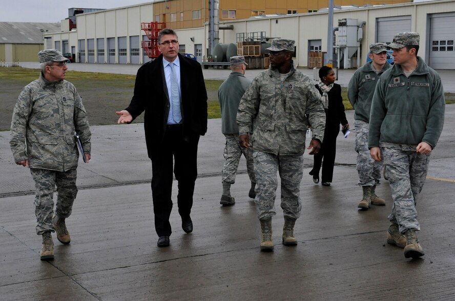 Andres Strans (middle), Central Regional Storage Facility site director, explains to Chief Master Sgt. James Morris, 86th Airlift Wing command chief (left), and Chief Master Sgt. James Davis (right), U.S. Air Forces in Europe and U.S. Air Forces Africa command chief, what the personnel at the CRSF do on a daily basis at the CRSF site, Jan. 14, 2014, Sanem, Luxembourg. Immersion tours are held as a way for senior leaders to gain a better understanding and perspective on how Airmen operate daily. (U.S. Air Force photo/Staff Sgt. Leslie Keopka)