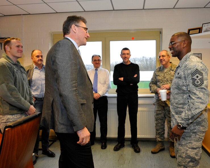 Chief Master Sgt. James Davis (right), U.S. Air Forces in Europe and U.S. Air Forces Africa command chief, and Chief Master Sgt. James Morris, 86th Airlift Wing command chief, receive a tour of the Central Regional Storage Facility site, Jan. 14, 2014, Sanem, Luxembourg. The CRSF site is a unit that stores Air Force equipment, including military vehicles, fuel systems, Basic Equipment Airfield Requirement kits, fire trucks and fire extinguishers. (U.S. Air Force photo/Staff Sgt. Leslie Keopka)