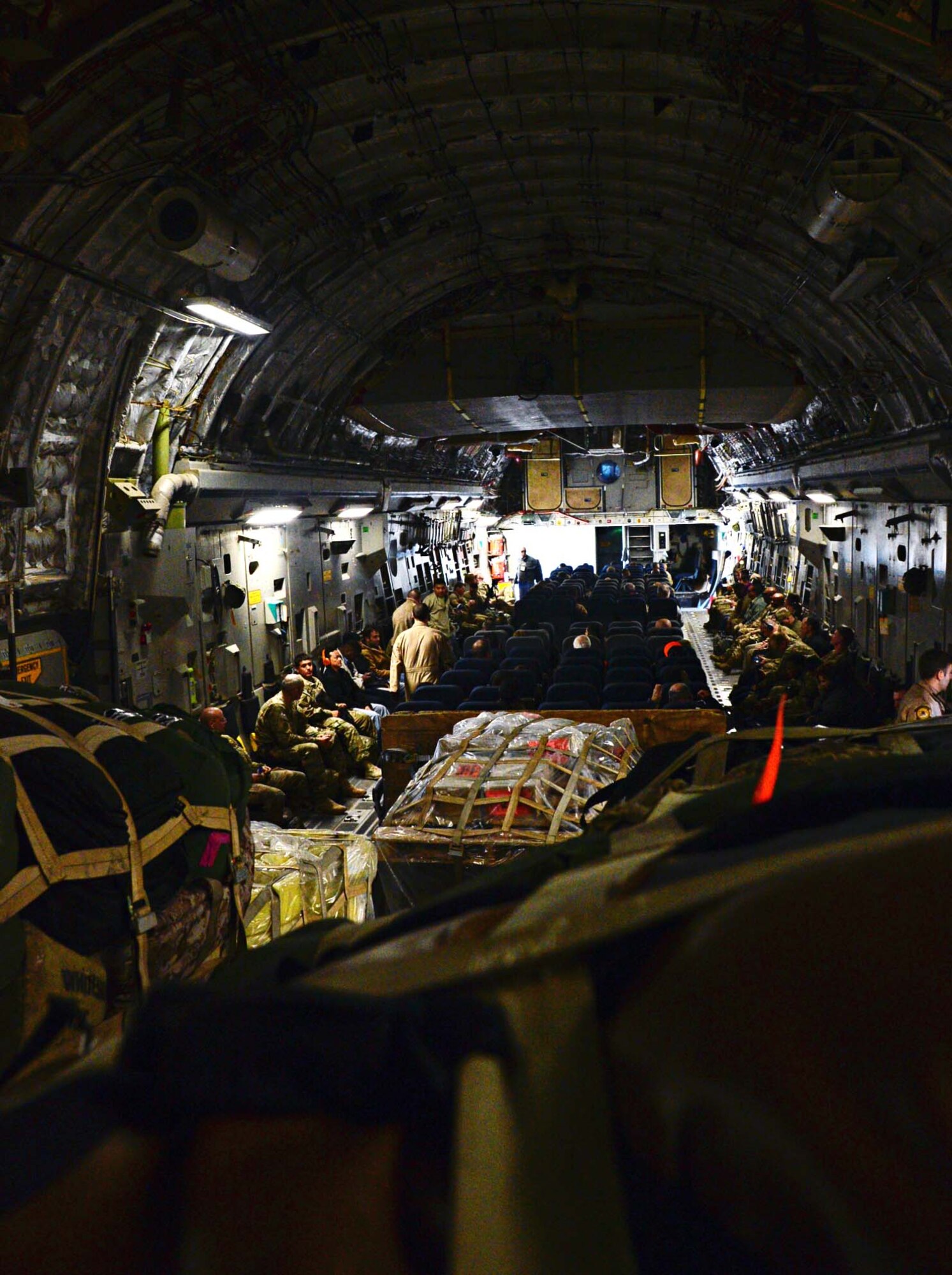 Forward deployers get settled for their flight to Bagram Air Field, Afghanistan, at an undisclosed location in Southwest Asia. Forward deployments are one of the daily operations on the flight line. (U.S. Air Force photo by Senior Airman Desiree W. Moye)