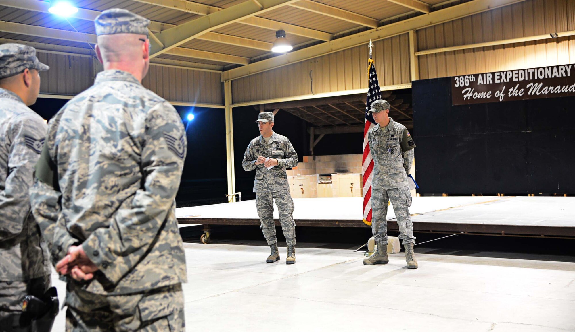 Col. John Klein Jr., 386th Air Expeditionary Wing commander, awards an Air Force Achievement Medal to Staff Sgt. Kenneth Soto, 387th Expeditionary Security Forces Squadron response force leader, at an undisclosed location in Southwest Asia. Soto, deployed from the 123rd Airlift Wing, Kentucky Air National Guard, was presented the medal for his response while off duty to a domestic violence incident in March 2013. (U.S. Air Force photo by Senior Airman Desiree W. Moye)