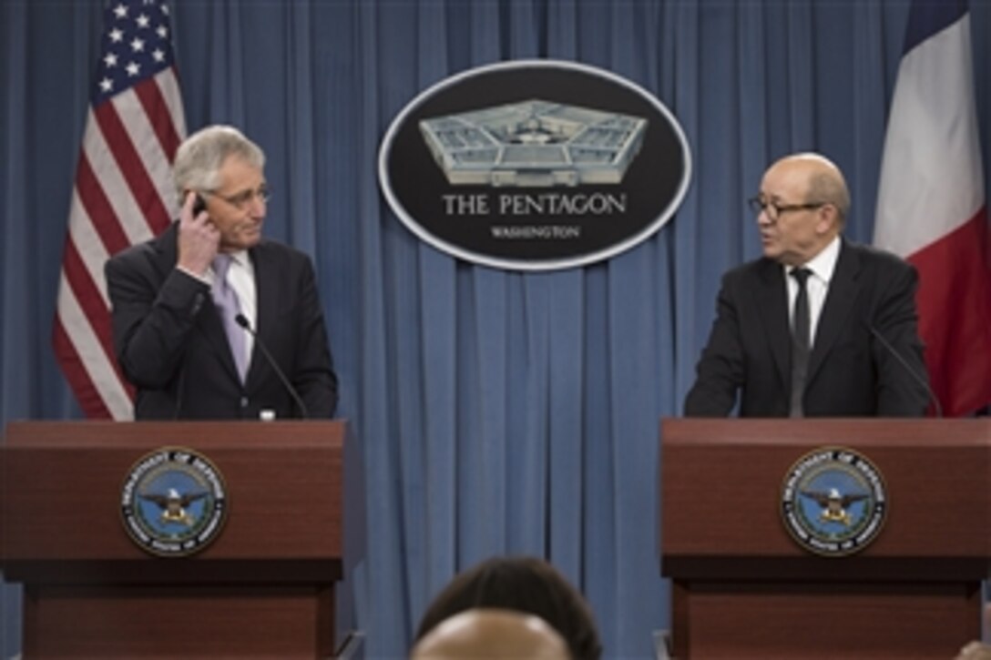 U.S. Defense Secretary Chuck Hagel and French Defense Minister Jean-Yves Le Drian conduct a joint press conference at the Pentagon, Jan. 24, 2014. Hagel reaffirmed the enduring security relationship between the U.S. and France, its oldest ally.