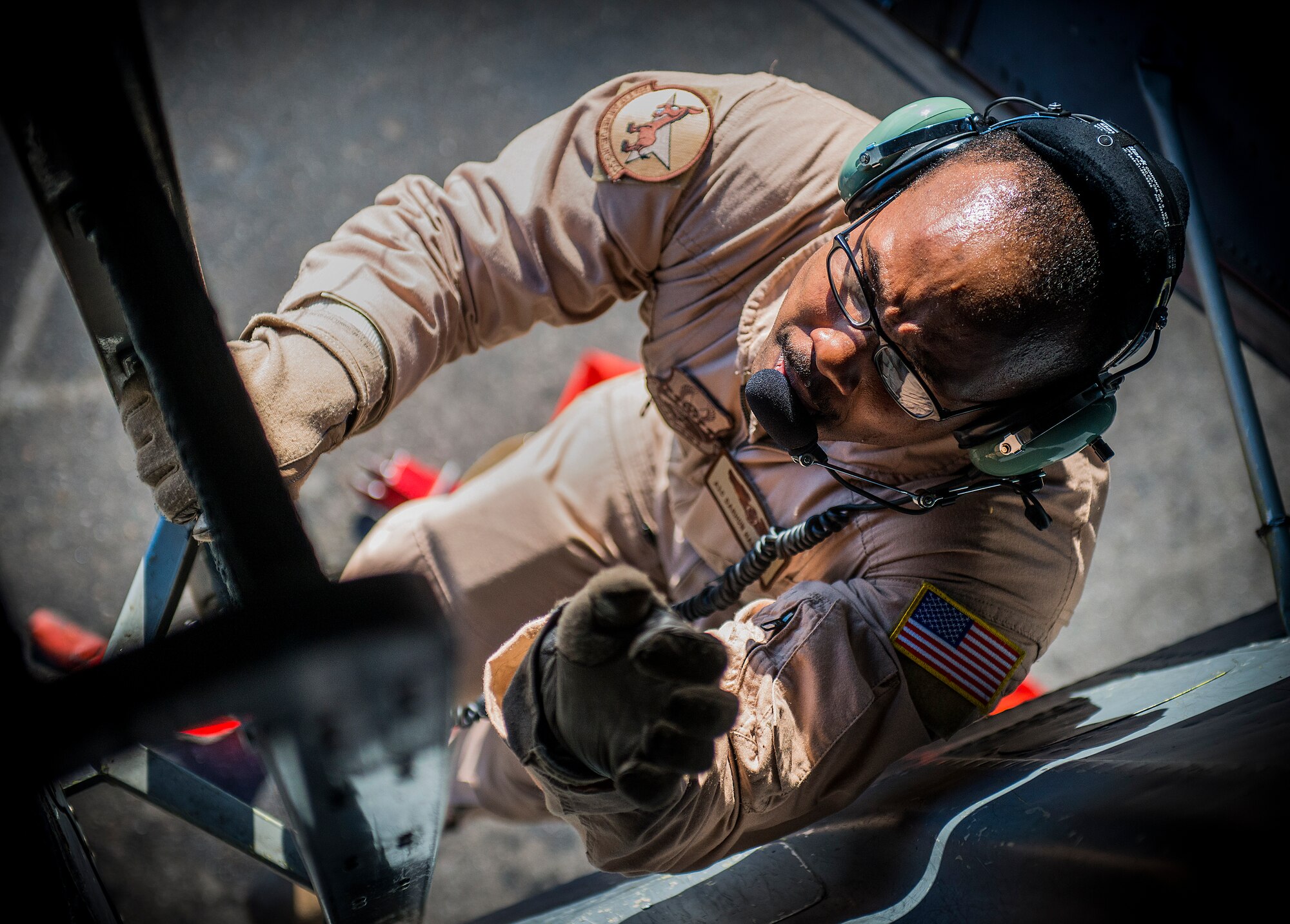 Airman 1st Class Darhon Hambrick, 22nd Expeditionary Air Refueling Squadron in-flight refueling specialist, climbs up a KC-135 Stratotanker crew ladder at the Transit Center at Manas, Kyrgyzstan, to start the pre-flight checks of the aircraft before a refueling mission over Afghanistan, Jan. 17, 2014. Hambrick is deployed from MacDill Air Force Base, Fla., and is a native of Nashville, Tenn. (U.S. Air Force photo/Staff Sgt. Travis Edwards)