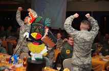 Airmen from the 80th Aircraft Maintenance Unit cheer for their squadrons’ nominees during the Maintenance Professional of the Year banquet at Kunsan Air Base, Republic of Korea, Jan. 23, 2014. The MPOY banquet recognizes the achievements of the maintenance group and honors maintenance professionals each year. (U.S. Air Force photo by Senior Airman Armando A. Schwier-Morales/ Released)