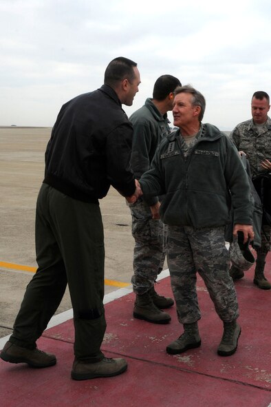 General Hawk Carlisle, Pacific Air Forces commander, is greeted by Col. Timothy Sundvall, 8th Fighter Wing vice commander, and Wolf Pack leadership upon his arrival to Kunsan Air Base, Republic of Korea, Jan. 24, 2014. The general visited Kunsan to learn more about the base’s mission and capabilities, as well as to thank the Airmen for everything they do here. (U.S. Air Force photo by Staff Sgt. Jessica Haas/Released)