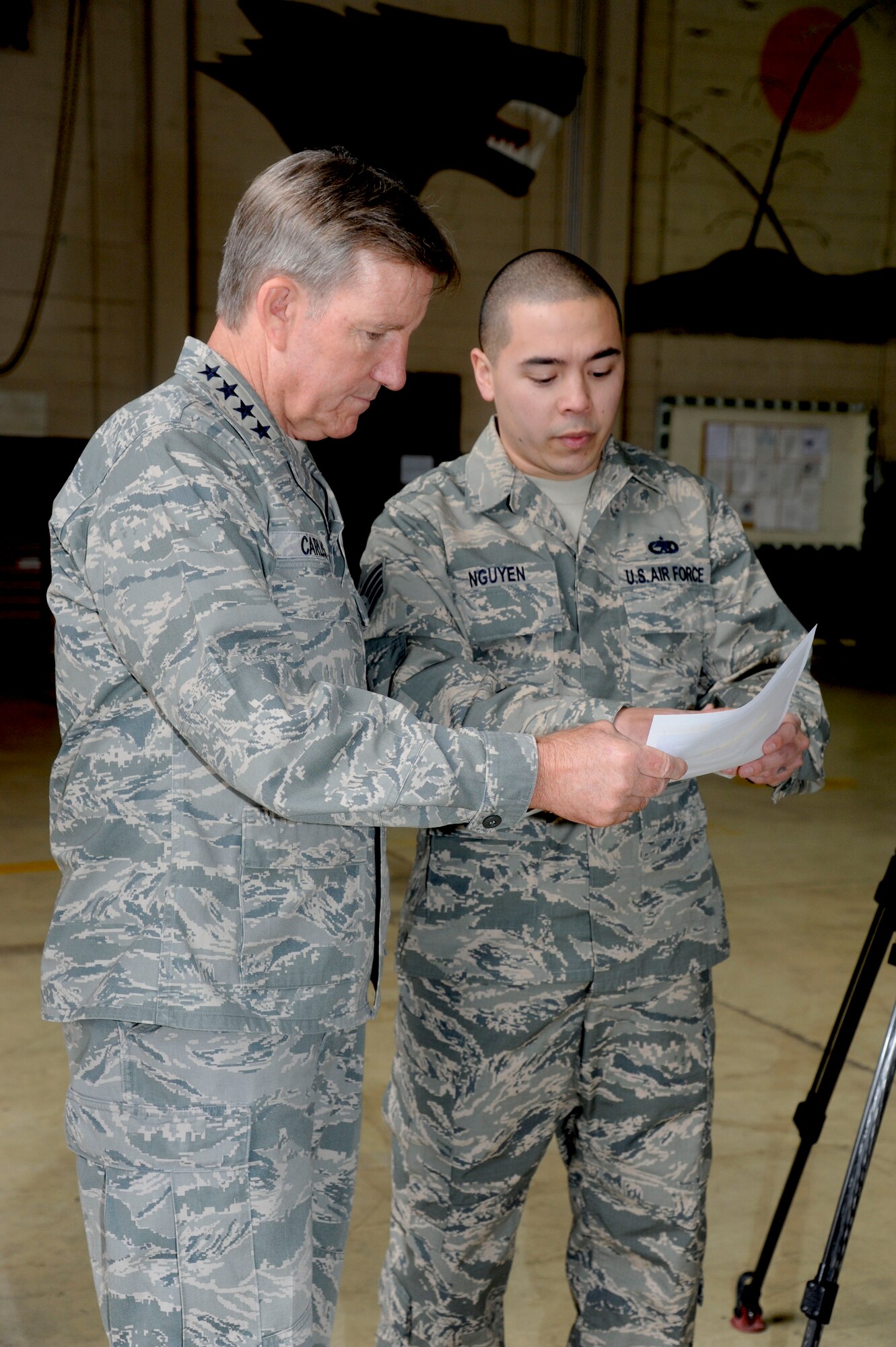 General Hawk Carlisle, Pacific Air Forces commander, is briefed by Staff Sgt. Shon Ngyuen, 8th Maintenance Squadron craftsman, on key issues concerning the 8th Fighter Wing’s aircraft maintenance during his visit to Kunsan Air Base, Republic of Korea, Jan. 24, 2014. The general visited Kunsan to learn more about the base’s mission and capabilities, as well as to thank the Airmen for everything they do here. (U.S. Air Force photo by Staff Sgt. Jessica Haas/Released)