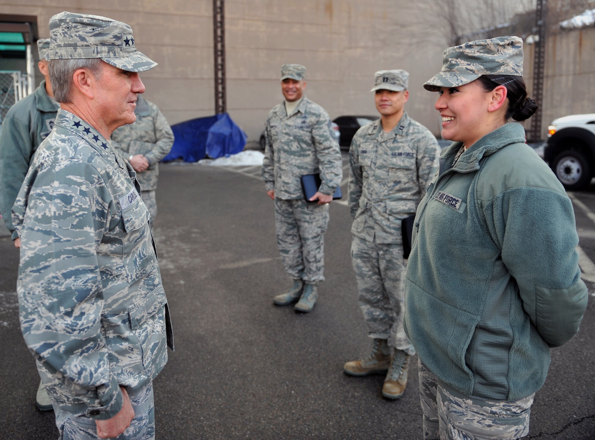 Gen. Hawk Carlisle, Pacific Air Forces commander, speaks to Airman 1st Class Zoe Reyes, 607th Air and Space Operations Center, at Osan Air Base, Republic of Korea, Jan. 22, 2014. Reyes was chosen as the first outstanding performer Carlisle would meet and greet during his visit to the AOC. (U.S. Air Force photo/Senior Airman Siuta B. Ika)